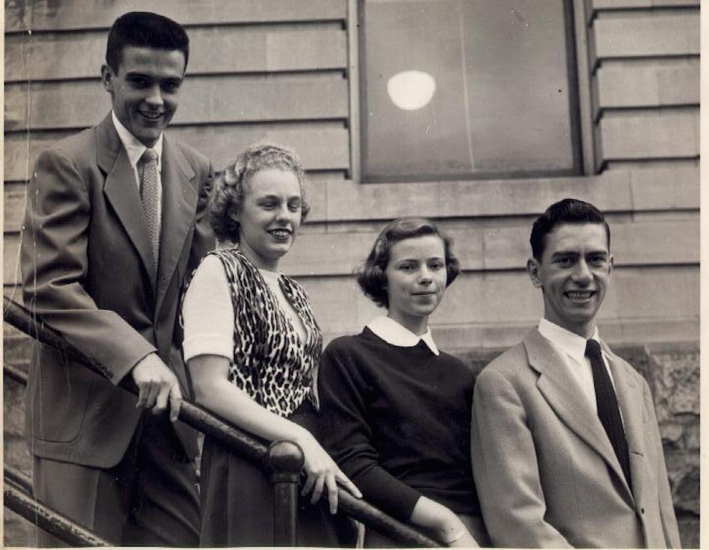 Four people from the class of 1951. Standing from left to right are: William Sullivan, Claire Ducharme, Lucille Brunelle, and Fran Laposta. They are outside but exactly where is not known. 快播成人 Junior College.